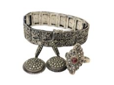 A silver bracelet,