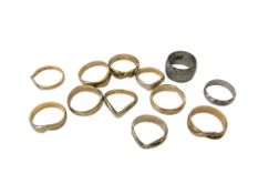 Twelve brass sample wedding bands