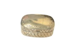 A small silver pill box