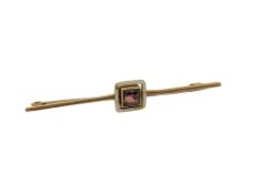 A yellow gold white enamelled and gem stone set pin CONDITION REPORT: 2g
