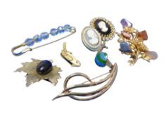 A quantity of costume brooches