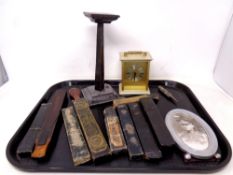 A tray of vintage cut throat razer cases, razor blade strop, battery operated mantel clock,