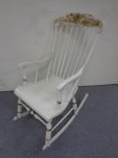 An antique Scandinavian rocking chair painted in an oriental style