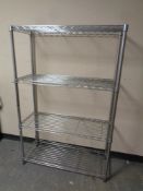 A set of metal four tier shelving