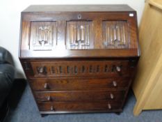 A Jaycee oak linen fold writing bureau