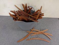 A quantity of mid 20th century teak clothes hangers