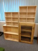 An antique pine glazed door wall cabinet and three sets of open shelves