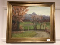 Continental school, a country lane with mountains beyond, oil on board,