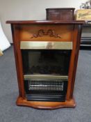 A Dimplex electric coal effect fire in surround