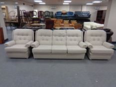 A mid 20th century Parker Knoll three piece lounge suite in oatmeal coloured fabric