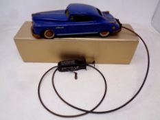 A mid 20th century Arnold tin plate Primal Coupe with manual wind remote control and cable