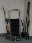 A set of three thread folding steps and a small quantity of garden tools