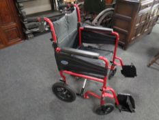 A folding light weight wheel chair with footrests
