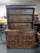 An Ercol Welsh dresser in an antique finish