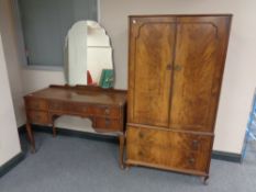An early 20th century mahogany double door linen cupboard fitted drawers beneath,