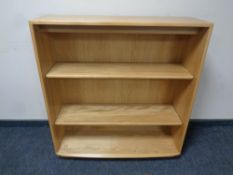 A set of Ercol solid elm open bookshelves