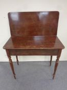 A 19th century mahogany turnover top table