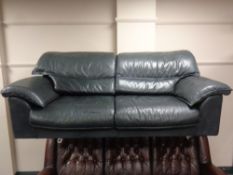 A late 20th century Scandinavian green leather two seater settee with chrome legs