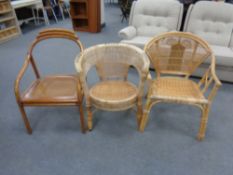Three assorted bamboo and wicker armchairs