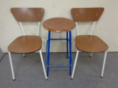 A pair of tubular metal and melamine dining chairs,