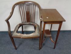 An Edwardian inlaid mahogany two tier occasional table together with a mahogany armchair