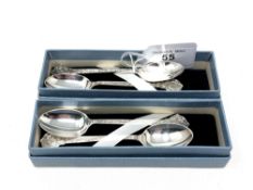 Two boxed pairs of Lindisfarne silver teaspoons, Reid & sons, Sheffield marks.