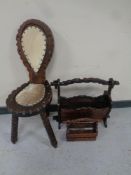 A rustic spinning chair upholstered in hide together with two further rustic magazine racks