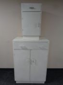 A metal medical linen cabinet together with bedside cabinet fitted a drawer