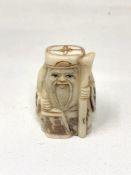A Japanese bone carving - Village Elder with Staff.