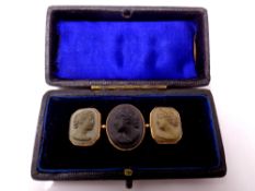 An antique gilt metal tryptich cameo broach