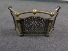 A Victorian cast iron and brass fire guard