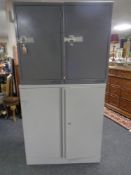 A metal double door stationary cupboard together with two further metal single door lockers