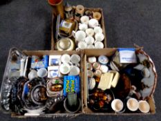 Three boxes containing miscellanea to include continental pottery tea service, commemorative mugs,