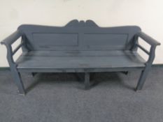 A painted antique scroll arm bench, 189cm wide by 52cm deep by 90cm high.