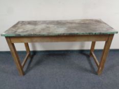 An early 20th century plank top work table
