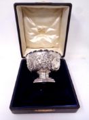 An embossed silver pedestal bowl, London marks.