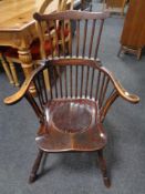 A 19th century stick back commode armchair