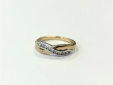 A 9ct gold CZ crossover ring, size Q CONDITION REPORT: 2.