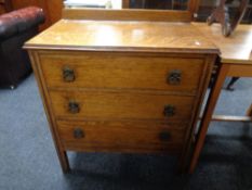 An Edwardian oak chest of three drawers