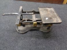 A set of early 20th century cast iron grocer's scales