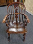 A 19th century elm Windsor armchair