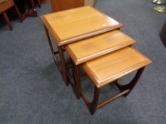 A nest of three mid 20th century teak G plan tables