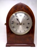 A 19th century inlaid mahogany arch topped mantel clock by J M.