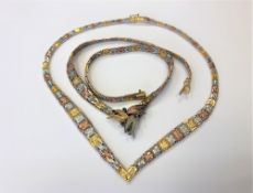 Two three-tone silver necklaces, one set with synthetic sapphires.