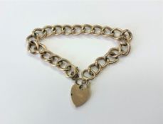 A 9ct gold padlock bracelet CONDITION REPORT: 11.