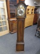 A Tempus Fugit oak cased granddaughter clock