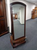 A mahogany effect cheval mirror fitted a drawer.