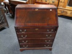 A reproduction inlaid mahogany bureau (as found)
