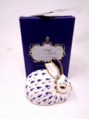 A Royal Crown Derby rabbit paperweight with gold stopper, boxed.