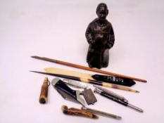 A box containing pocket knives, stamp case,